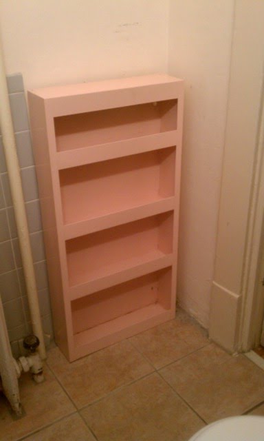 nice old pink metal cabinet .. from thrift store to bathroom